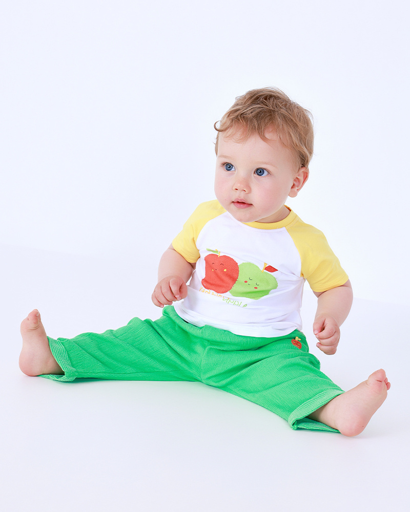 Boys' fleece outfit with apple T-shirt, green pants, and zip-up jacket