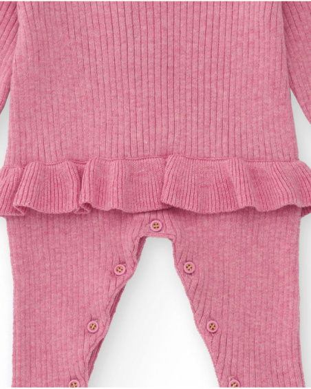 Knit romper for girl in pink with decorative ruffles.