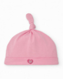 Baby girl hat in pink with knot detail and embroidered face Baby girl hat in pink with knot detail and embroidered face