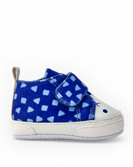 Prewalker shoe for baby boy in blue with geometric print and smiling face detail