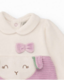 Velvet romper for baby girl in cream and lilac tones with embroidered face design. Velvet romper for baby girl in cream and lilac tones with embroidered face design.