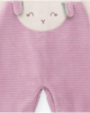 Velvet romper for baby girl in cream and lilac tones with embroidered face design. Velvet romper for baby girl in cream and lilac tones with embroidered face design.