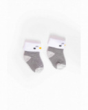 Knit socks for baby boy with grey stripes, white cuff, and penguin detail Knit socks for baby boy with grey stripes, white cuff, and penguin detail
