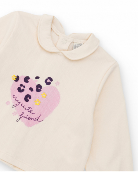 Girl’s outfit with ivory blouse featuring heart print and floral print bloomer shorts. Girl’s outfit with ivory blouse featuring heart print and floral print bloomer shorts.