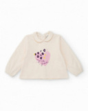 Girl’s outfit with ivory blouse featuring heart print and floral print bloomer shorts. Girl’s outfit with ivory blouse featuring heart print and floral print bloomer shorts.