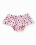 Girl’s outfit with ivory blouse featuring heart print and floral print bloomer shorts. Girl’s outfit with ivory blouse featuring heart print and floral print bloomer shorts.
