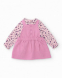 Girl’s outfit with pink dress and floral print blouse. Girl’s outfit with pink dress and floral print blouse.