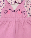 Girl’s outfit with pink dress and floral print blouse. Girl’s outfit with pink dress and floral print blouse.