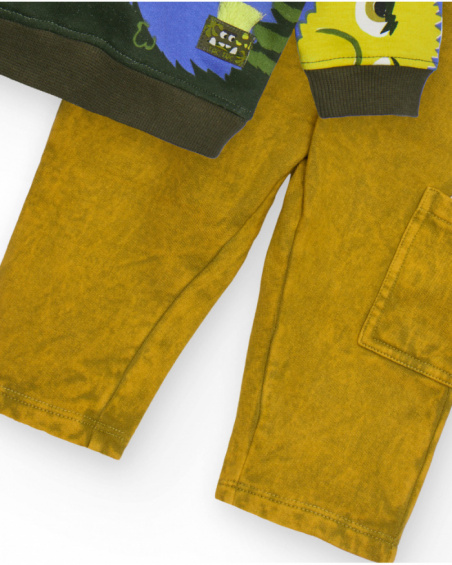 Boys' set with sweatshirt printed with fun creatures and mustard-colored pants.
