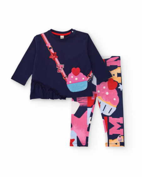 Girl’s outfit with navy blue t-shirt featuring purse appliqué and multicolored printed leggings. Girl’s outfit with navy blue t-shirt featuring purse appliqué and multicolored printed leggings.
