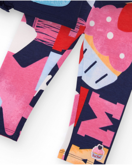 Girl’s outfit with navy blue t-shirt featuring purse appliqué and multicolored printed leggings. Girl’s outfit with navy blue t-shirt featuring purse appliqué and multicolored printed leggings.
