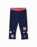 Navy blue leggings for girl with multicolored star print and shiny pink elastic waistband. Navy blue leggings for girl with multicolored star print and shiny pink elastic waistband.
