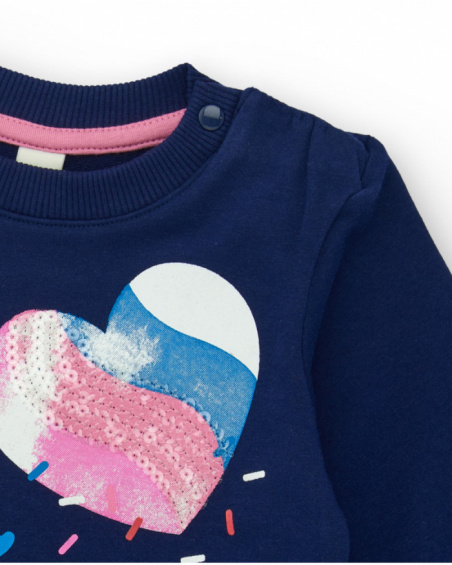 Navy blue sweatshirt for girl with shiny heart and asymmetrical back design. Navy blue sweatshirt for girl with shiny heart and asymmetrical back design.