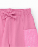 Pink pants for girl with sequin side pockets and adjustable waistband. Pink pants for girl with sequin side pockets and adjustable waistband.