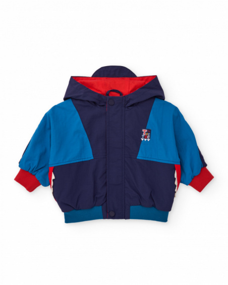 Windbreaker jacket for boy with navy and electric blue color blocks and red hood.