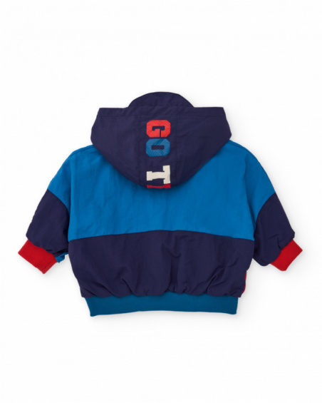 Windbreaker jacket for boy with navy and electric blue color blocks and red hood.