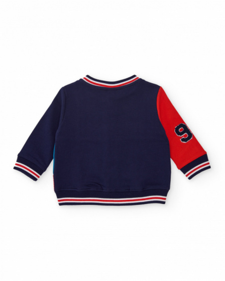 Navy blue fleece jacket for boys with red and blue details.