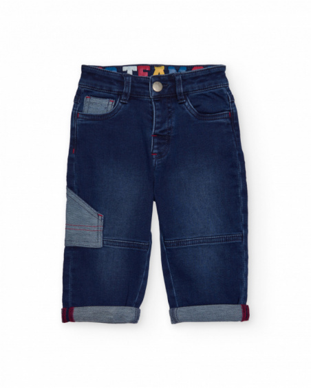Blue children's denim pants with pockets and contrasting details. Blue children's denim pants with pockets and contrasting details.