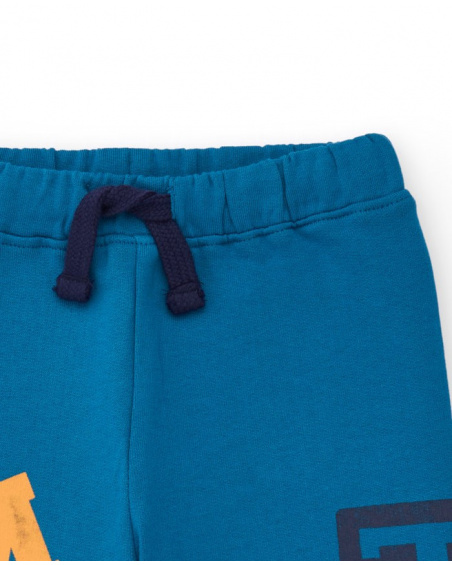 Fleece pants for boys in blue with graphic print and side pocket.