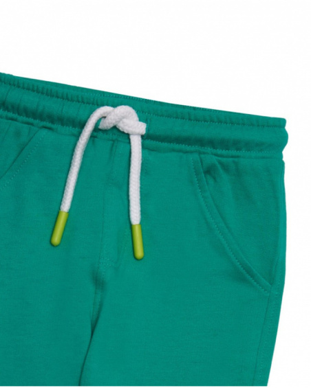 Green jersey pants for boys with rocket embroidery.