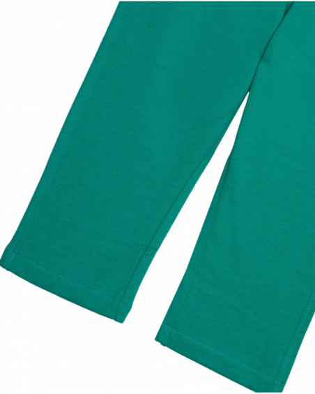Green jersey pants for boys with rocket embroidery.