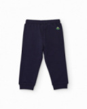 Navy blue knit pants for boy with adjustable waistband and small spaceship embroidery. Navy blue knit pants for boy with adjustable waistband and small spaceship embroidery.