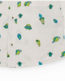 Long-sleeve white shirt for boy with space-themed print in green and blue tones. Long-sleeve white shirt for boy with space-themed print in green and blue tones.