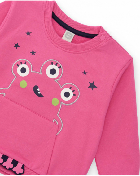 Girls’ set with pink sweatshirt featuring monster design and navy blue pants.