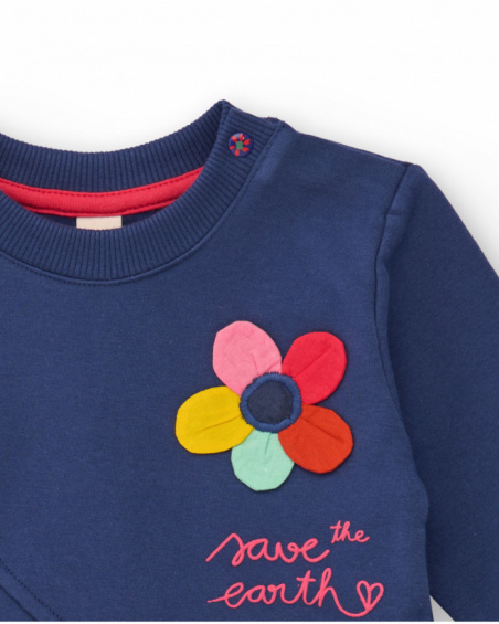 Girls' navy blue knit dress with flower appliqué and printed skirt. Girls' navy blue knit dress with flower appliqué and printed skirt.