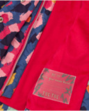 Girls' padded coat with multicolor print and heart-shaped pockets. Girls' padded coat with multicolor print and heart-shaped pockets.