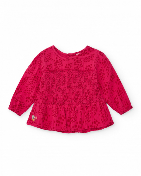 Girls' fuchsia blouse with smocking (honeycomb) detail.