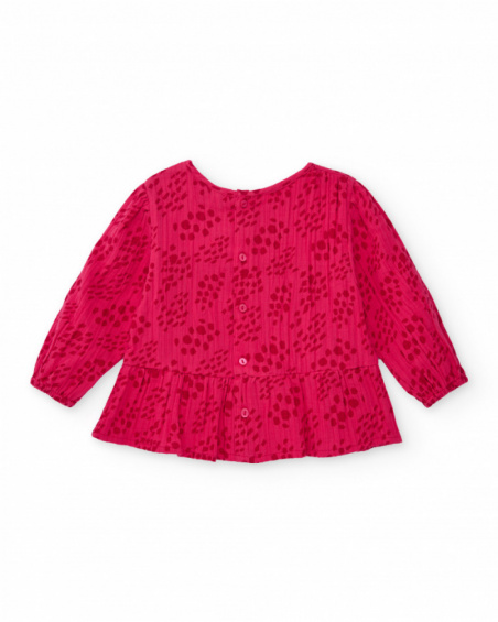 Girls' fuchsia blouse with smocking (honeycomb) detail.