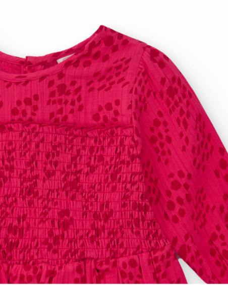 Girls' fuchsia blouse with smocking (honeycomb) detail.