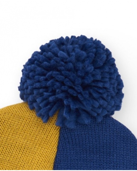 Hat for boy in blue, mustard and green color blocks with pom-pom
