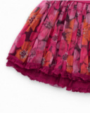 Girl’s skirt with pleated fuchsia tulle and floral print. Girl’s skirt with pleated fuchsia tulle and floral print.