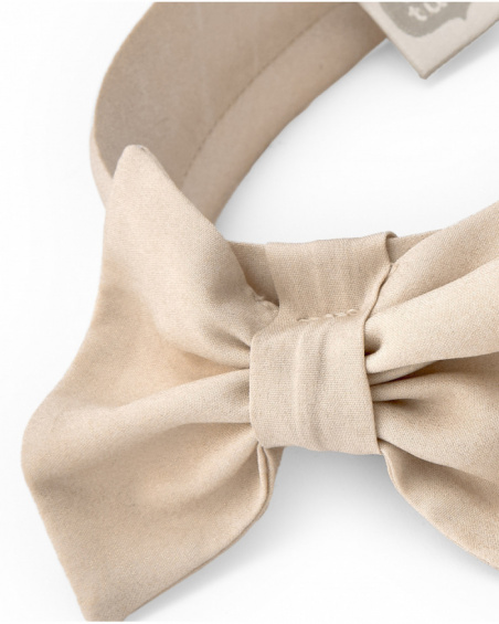 Beige girl’s headband with large decorative bow