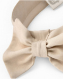 Beige girl’s headband with large decorative bow Beige girl’s headband with large decorative bow