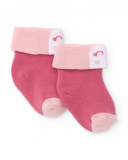 Baby girl socks in pink tones with smiling face design Baby girl socks in pink tones with smiling face design