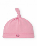 Baby girl hat in pink with knot detail and embroidered face Baby girl hat in pink with knot detail and embroidered face