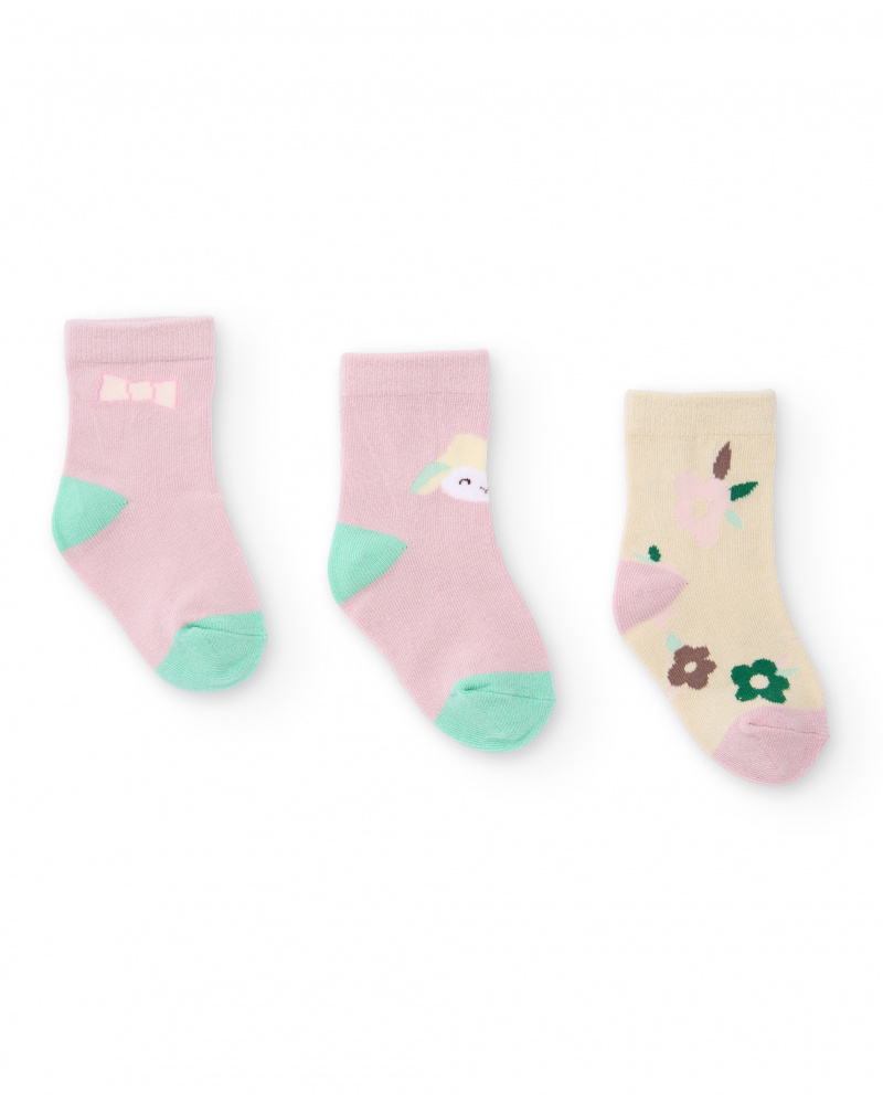 Set of 3 pairs of socks for newborn in pink and beige tones with assorted designs.