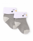 Knit socks for newborn in gray stripes with white cuff and penguin detail