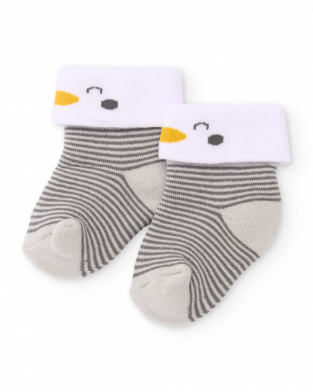 Knit socks for newborn in gray stripes with white cuff and penguin detail