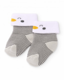 Knit socks for baby boy with grey stripes, white cuff, and penguin detail Knit socks for baby boy with grey stripes, white cuff, and penguin detail
