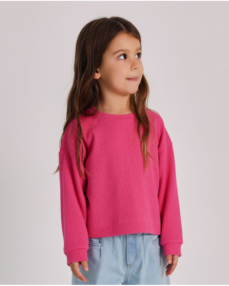 Girls' fuchsia knit sweater with rocket embroidery.