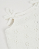 Girls’ knit dress with openwork motifs