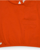 Camiseta naranja para niña con flor y mangas abullonadas Camiseta naranja para niña con flor y mangas abullonadas