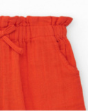 Pantalón culotte naranja para niña con cintura fruncida y lazo Pantalón culotte naranja para niña con cintura fruncida y lazo