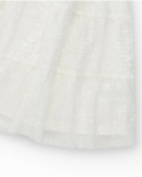 Falda para niña en blanco con lentejuelas y cintura elástica Falda para niña en blanco con lentejuelas y cintura elástica