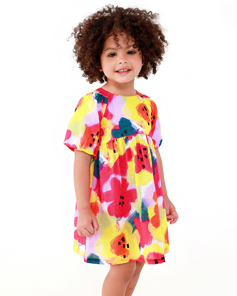 Vestido de plana para niña en lila con flores amarillas y rosas y mangas abullonadas