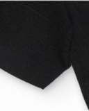 Jersey corto de punto negro con diseño asimétrico para niña